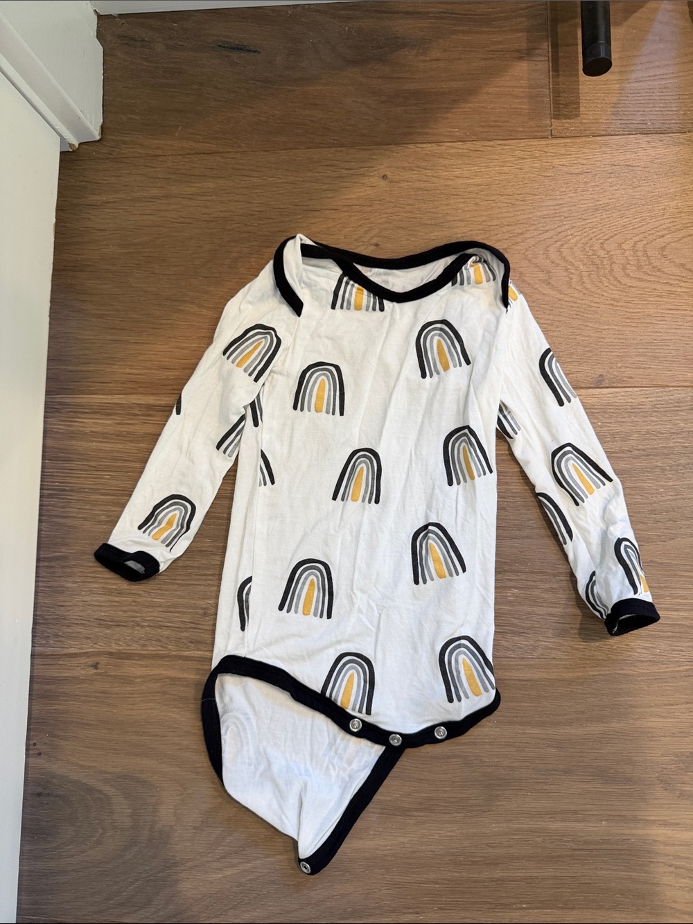 Kyte BABY White Long-Sleeve One-Piece with Black Trim and Mustard Accents